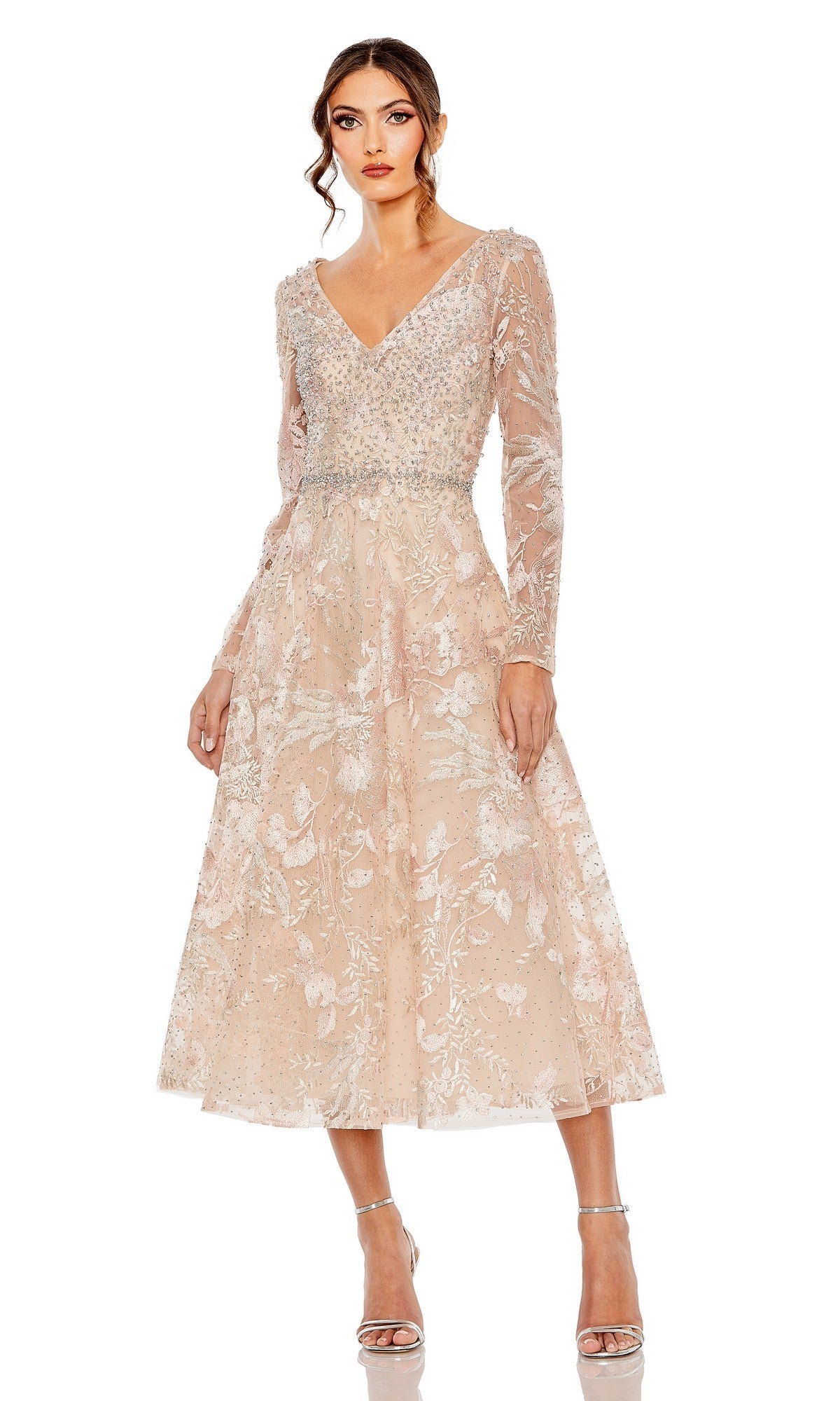 A woman in the blush Midi Wedding Guest Dress: Mac Duggal 20489 with silver heels stands against a white background—a stylish choice for wedding guests.